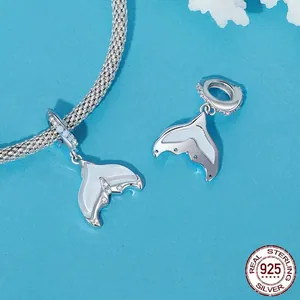 S925 sterling silver mermaid tail charms with opal inlay on a blue woven mesh bracelet