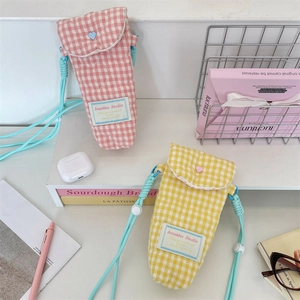 Quilted checkered padded camera storage bag with heart buckles and braided strap