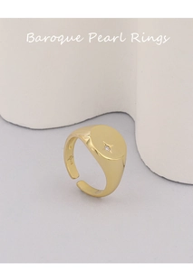 Close-up of S925 sterling silver ring with gold plating and small inset diamond