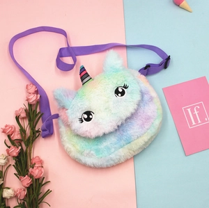 Detailed close-up of rainbow plush unicorn bag with soft faux fur and purple strap
