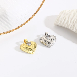 Minimalist irregular wavy heart pendants in 18k gold and silver with cubic zirconia stones