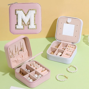 Portable jewelry storage box with embroidered letter M for rings and necklaces