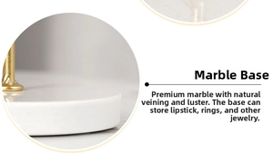 Macro view of white marble base with gold metal rod for jewelry and lipstick storage