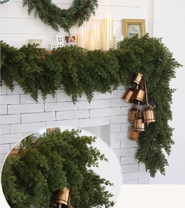 Detailed Christmas cedar garland with vintage bronze cowbells showing a 2-piece layered effect
