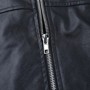 Close-up of premium black leather jacket showing silver metal zipper and stitching detail