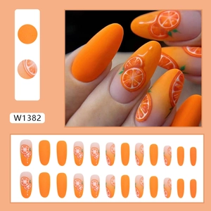 Oval orange press-on nails with citrus fruit patterns and gradient matte finish
