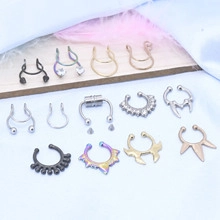 Flat lay of various non-piercing U-shaped nose rings in silver gold and black finishes