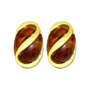 Vintage style oval earrings with amber resin in a decorative gold metal S-curve frame
