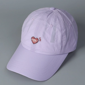 Close-up of lilac quick-dry fabric and red heart FAMILY embroidery on the baseball cap