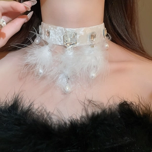 Detailed close-up of a white velvet choker with feathers and water-drop pearl charms