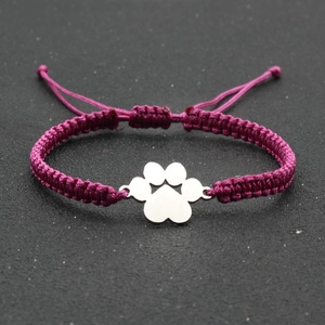 Adjustable purple braided rope bracelet with silver dog paw charm for luck