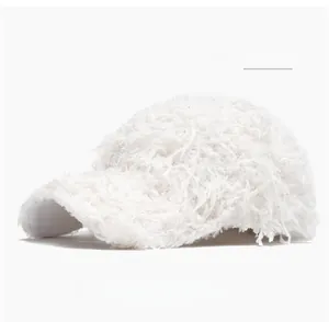 Close-up side view of off-white fuzzy plush baseball cap with shaggy faux fur texture