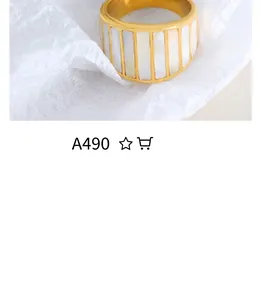 Detail of 18K gold plated ring featuring rectangular white mother of pearl inlays