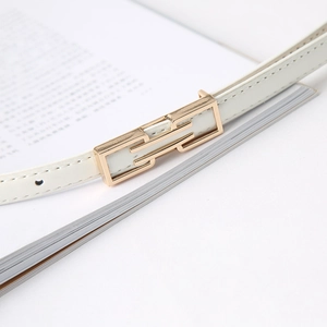 Detail of white leather belt with rectangular gold metal buckle for jeans and dresses