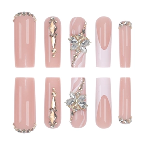 Long coffin press-on nails with champagne gold bows and glittering rhinestones