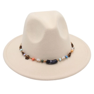 Detail of bohemian fedora hat band with colorful wooden beads and white shells