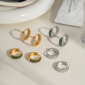 Four pairs of 18K gold and silver C-shaped huggie earrings with zircon micro-pave