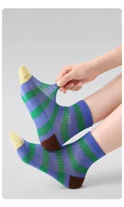 Close-up of breathable striped mesh socks showing ultra-thin material and high elasticity