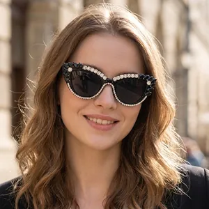 Fashionable cat eye sunglasses with rhinestones and black gems for party and street style