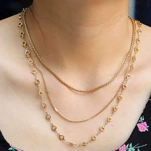 Three-layer 18K gold plated titanium necklace with heart-shaped connector on model