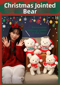 Detailed shot of Christmas teddy bears with removable clothes and movable leg joints