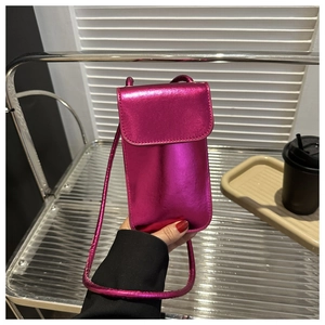 Detailed view of magenta metallic PU leather mini crossbody phone bag with flap closure