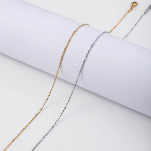 Minimalist stainless steel water wave and cross chains in gold and silver finishes