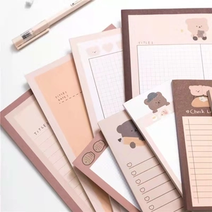 Macro detail of cute bear sticky notes featuring grid, lined, and check list layouts