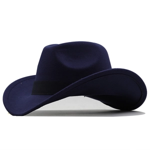 Detail of dark blue felt cowboy hat featuring a classic black grosgrain ribbon band