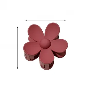 Macro detail of dark pink matte flower hair claw clip with size 7.5cm dimensions