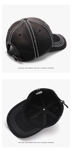 Detail of black baseball cap featuring white contrast stitching and adjustable metal buckle