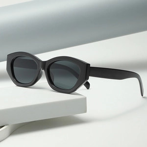 Chic black cat eye sunglasses with thick geometric frames for high-fashion street style