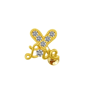 Detail of heart shaped gold stud earring with white crystals and Love lettering