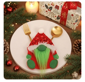 Gnome cutlery holder in red and green felt on a festive Christmas dinner table setting