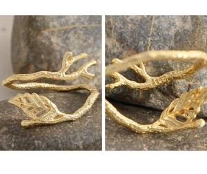 Macro detail of leaf-shaped S925 sterling silver gold-plated ring with branch design