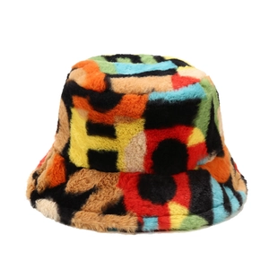 Colorful plush bucket hat with vibrant faux fur patchwork and artistic letter patterns