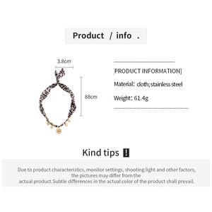 Leopard print fabric necklace with sun pendant, measuring 88cm by 3.8cm dimensions