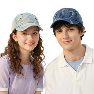 Distressed denim baseball cap with washed ripped details in light and dark blue denim