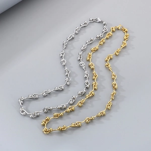 Interlocking geometric stainless steel necklaces in gold and silver bead link design