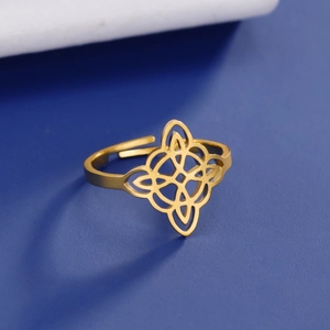 Macro detail of golden stainless steel double-layer witch's knot adjustable ring band