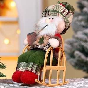 Close-up of a festive plush Santa doll in a checkered hat sitting on a yellow rocking chair