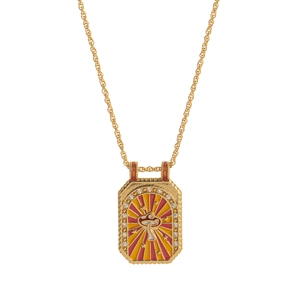 Detail of vintage gold tarot necklace featuring a mushroom motif with red enamel and crystals