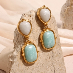 Detail of drop earrings with 18K gold plating and natural amazonite stones on stone