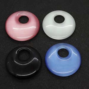 Polished 40mm round cat eye stones in pink, white, black, and blue colors for DIY jewelry