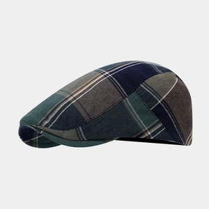 Detail view of the vintage plaid beret hat with British style patchwork wool texture