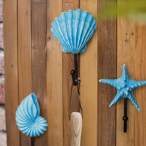 Mediterranean ocean-style wall hooks with starfish, shell, and nautilus designs