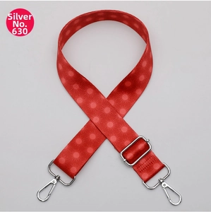 Close-up of red ethnic pattern handbag strap No. 630 with silver lobster clasps