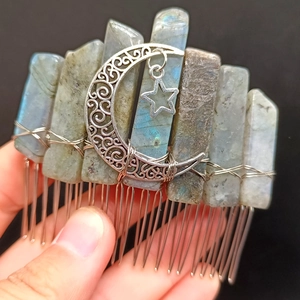 Macro shot of handmade labradorite hair comb with moon and star metal charms