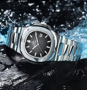 Close-up of black textured dial with date display on wet rock for waterproof feature
