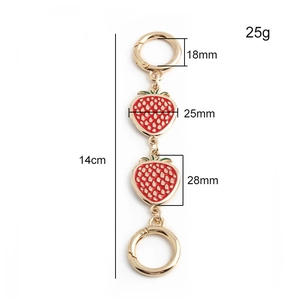 Detailed measurement showing 14cm red strawberry bag charm with gold metal clasp